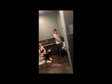 Girl uses toilet and talks in mens room