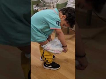 baby removing his diaper alone