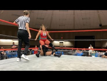 Vikki Vee with a stink face to Skylar Slice