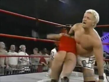 Dusty Rhodes spanks Trinity in thong