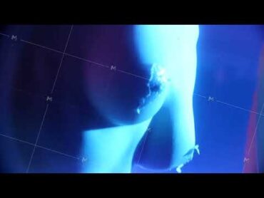 Beautiful naked woman with perfect body dancing on stage. Topless girl dancing on stage