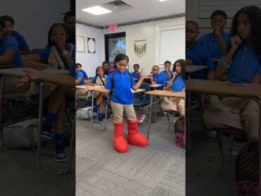 Girl comes to school with big red boots on shorts