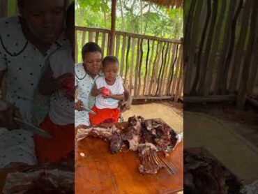 African village mum sharing whole grilled goat with her daughter 🐐🔥 VillageLife shorts