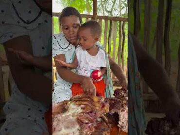 African village mum sharing whole grilled goat with her daughter 🐐🔥 VillageLife shorts
